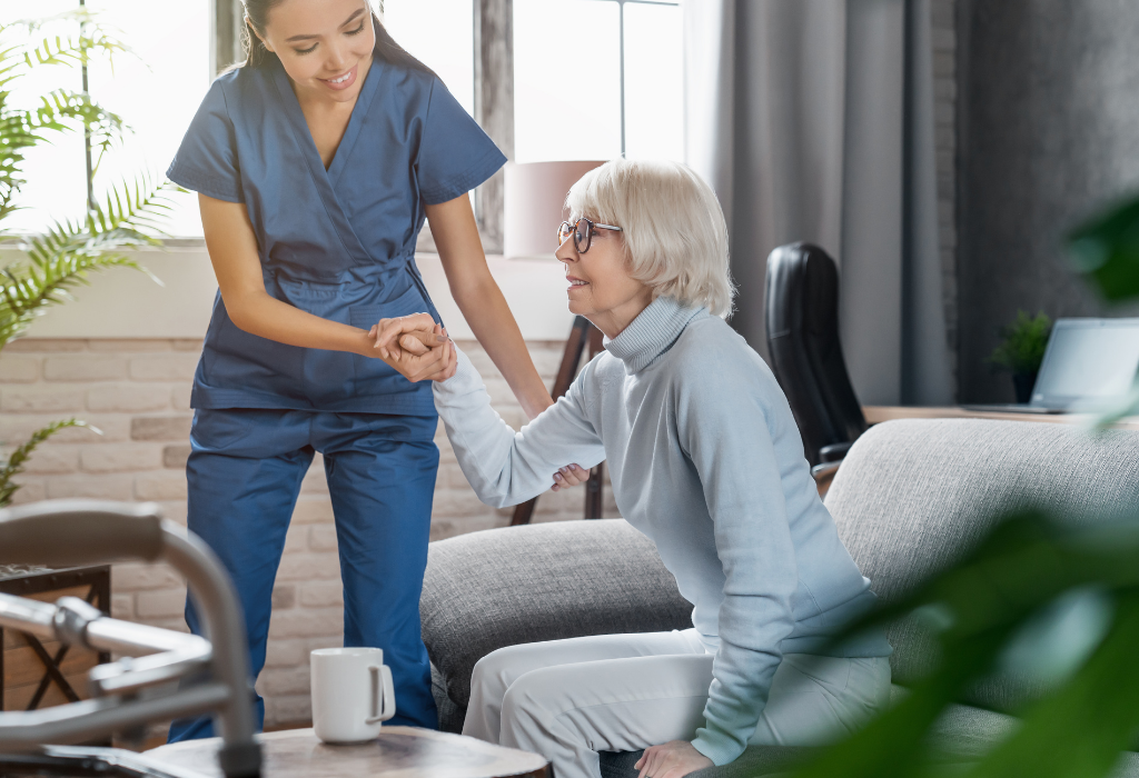 Carer providing private palliative care to an elderly person in a comfortable home setting, offering compassionate support and assistance.