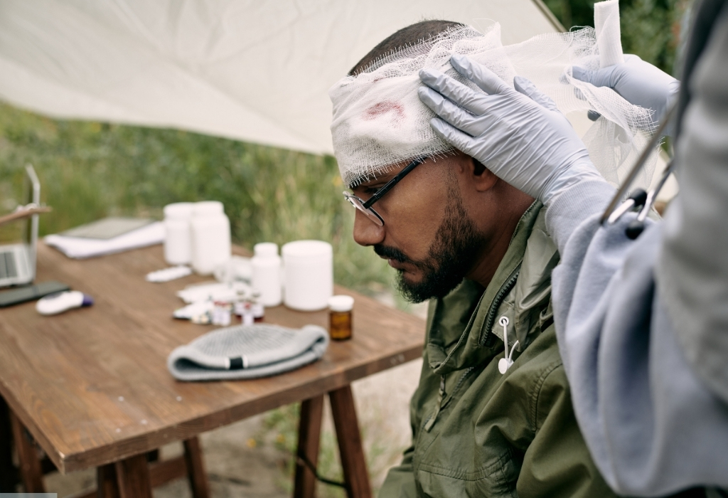 Man with a head bandage receiving support as part of acquired brain injury home care services.