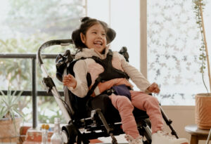 A disabled child sitting in the wheelchair need for respite care for a child with disability