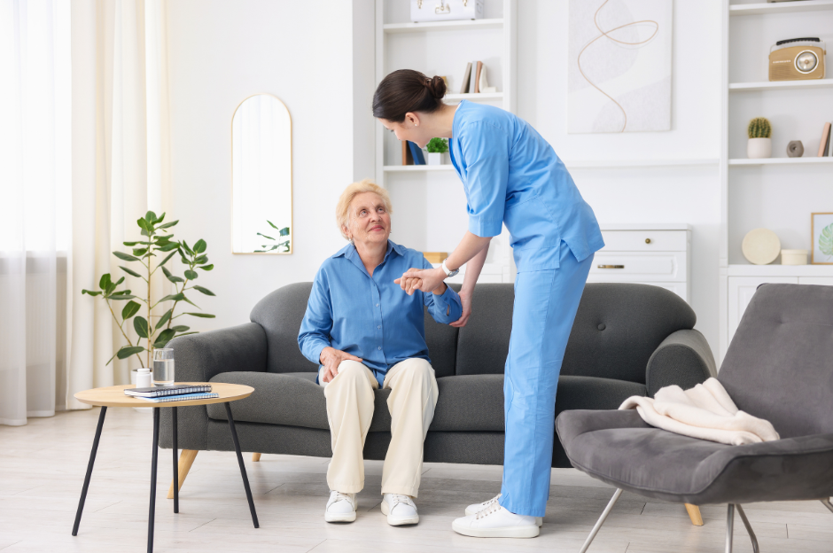 Carer assisting an elderly woman at home, demonstrating cqc compliance for home care through safe, compassionate personal care